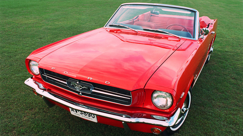 A 1965 Ford Mustang convertable parked on grass