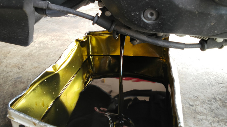 Used oil being drained from an automobile