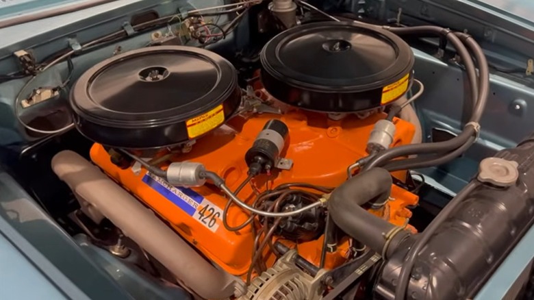 An under-hood shot of a Ramcharger 426 Max Wedge V8 in a 1963 Dodge 330