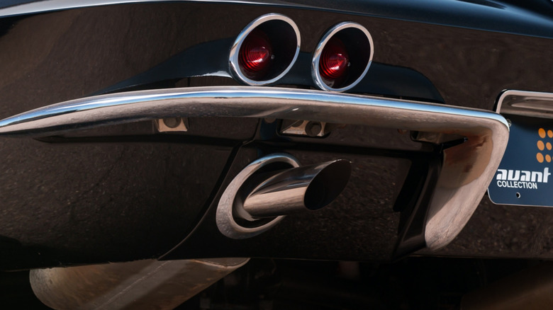 Black 1962 C2 Corvette exhaust pipe and taillight closeup