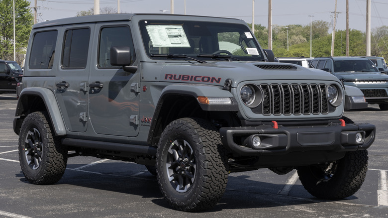 A grey 2026 Jeep Wrangler Rubicon 4-door in a dealership lot