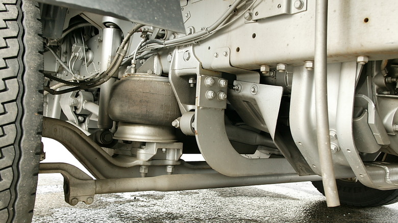 A beam axle suspension with an airbag