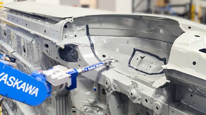 An automated seam sealer applicator