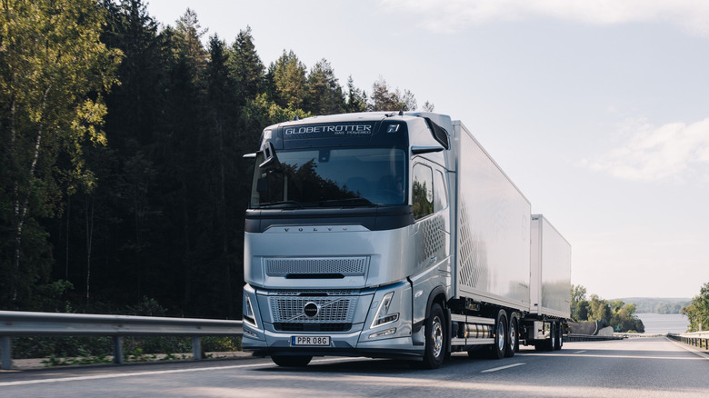 A Volvo FH Aero pulling two trailers on road