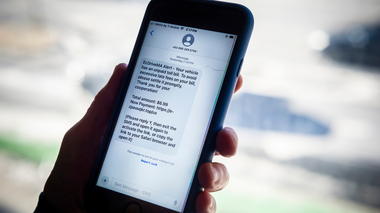 A message on smartphone screen indicating an unpaid toll charge