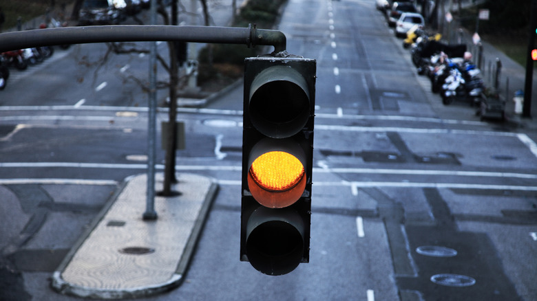 A yellow light on a big street