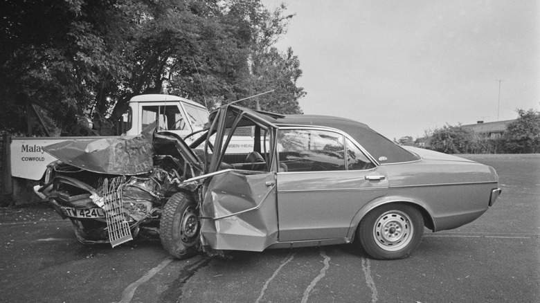 A side shot of a crashed 1973 Ford Granada