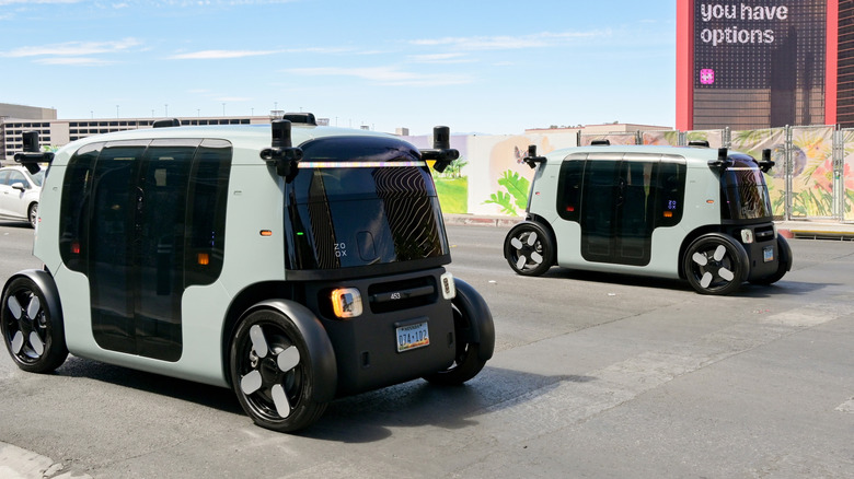 Amazon's Zoox robotaxis parked in a city parking lot.