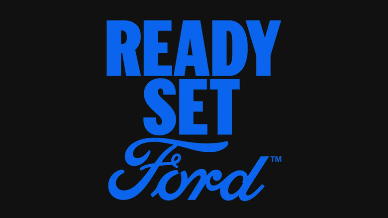 A black background with blue bold text reading "Ready Set Ford," Ford's new slogan starting 2025.