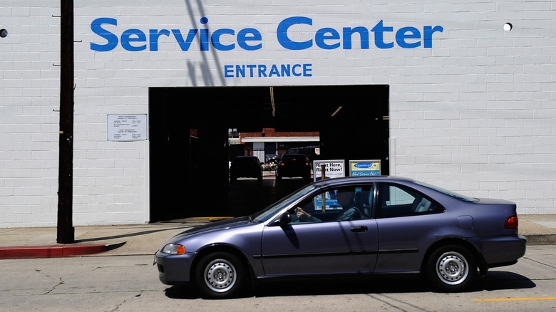 A car pulls up successful beforehand of a Honda work center