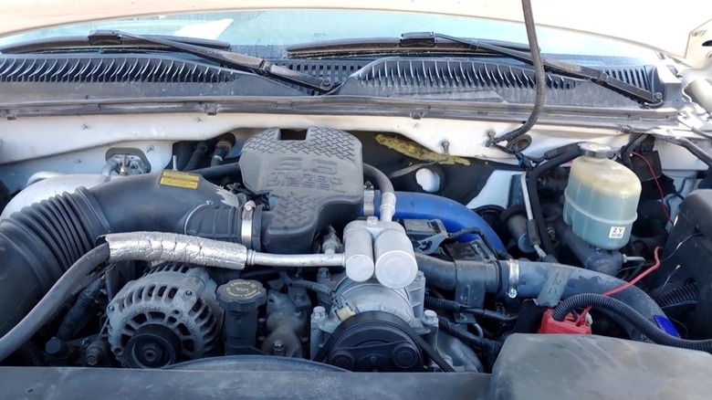 6.6 Duramax LB7 V8 sitting in the engine bay of a Chevy Silverado 2500 HD