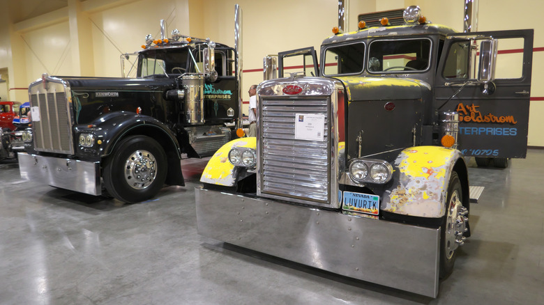 Vintage Kenworth (L) and Peterbilt (R) semi trucks on display in Las Vegas