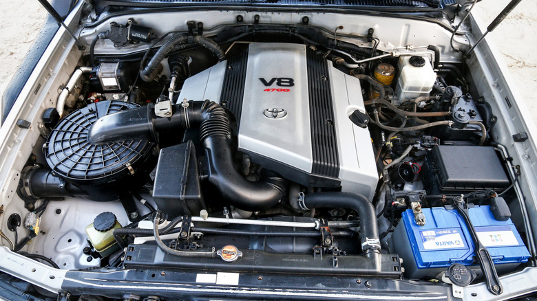 A Toyota 2UZ-FE V8 engine nestled in a Toyota Land Cruiser 100 Series engine bay