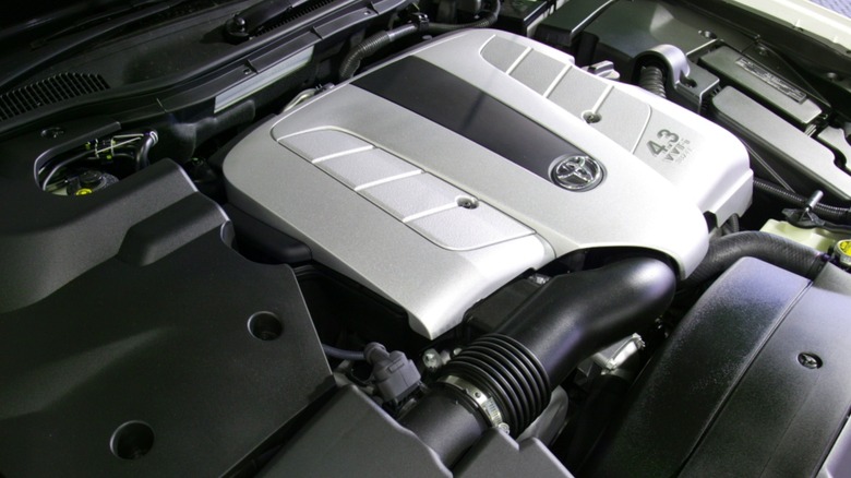 A Toyota 3UZ-FE engine with a silver and black cover