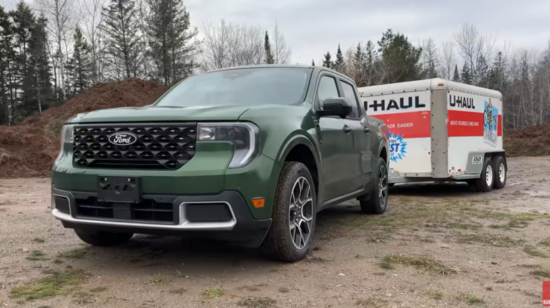 A U-Haul trailer hitched to a 2025 Ford Maverick pickup