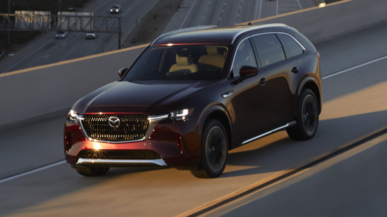A 2024 Mazda CX-90 driving on a highway