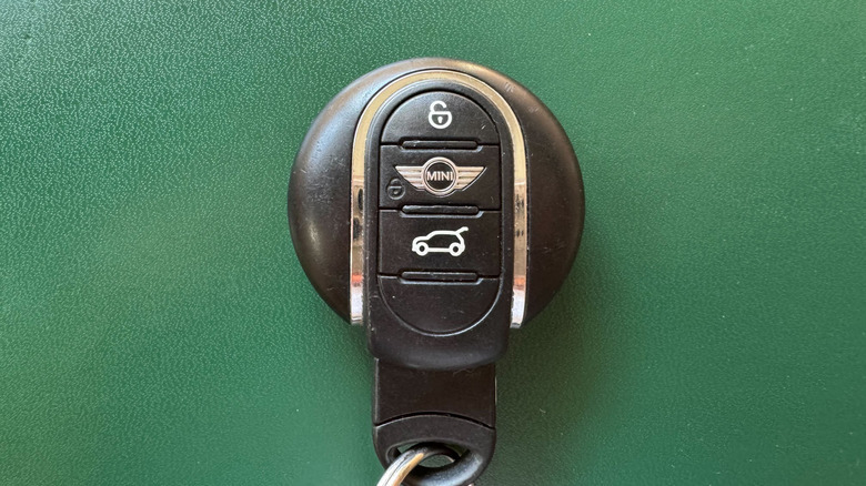 A close-up shot of my Mini key on a dark green moleskin journal