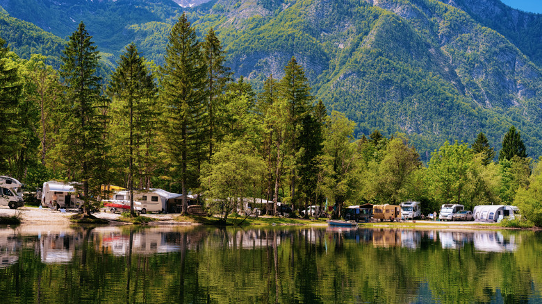RVs and campers parked at a mountain lakeshore