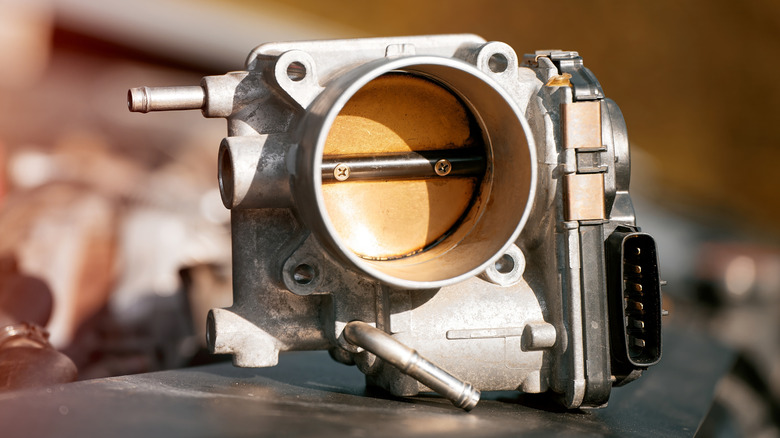 An electronic throttle body showing the butterfly valve that regulates the air flow