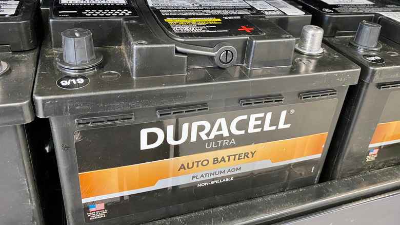 Car batteries on a shelf in an auto parts store