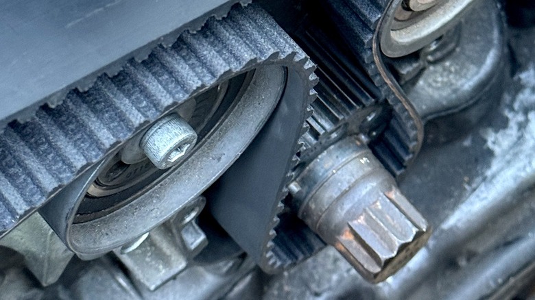 Routing the timing belt on a B5-generation Audi S4's 2.7-liter twin-turbo V6 engine.