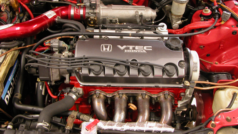 Engine bay of a red Honda CRX DX featuring the D15B VTEC engine