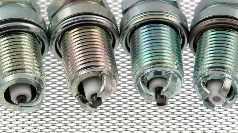 Different types of spark plugs on mesh