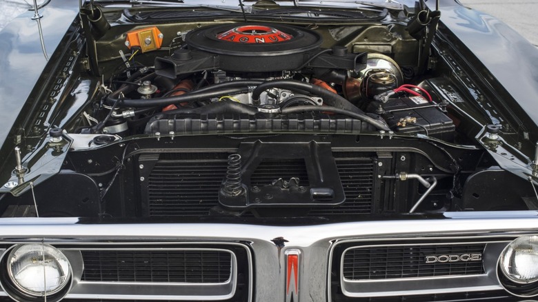 vintage Dodge Charger R/T with hood open, revealing 404 Magnum engine