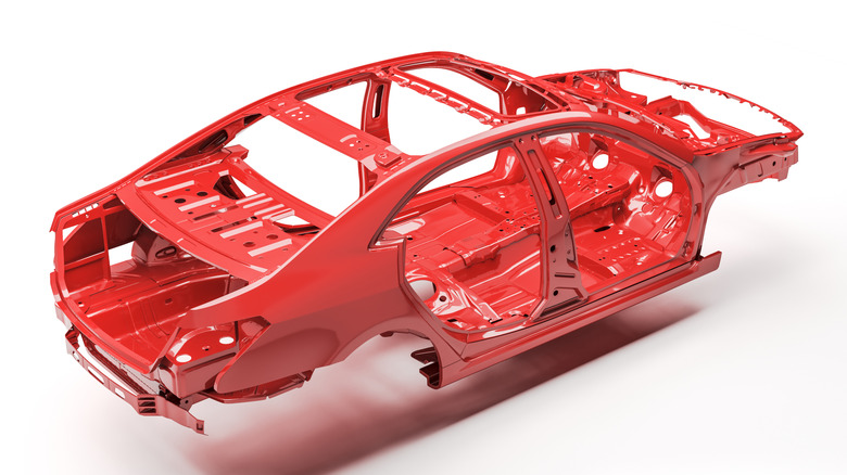 A red painted unibody car frame