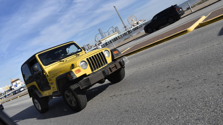 Galveston, TX USA January 11, 2026 - A portrait of a Jeep Wrangler cruising near Pleasure Pier on Seawell Blvd.