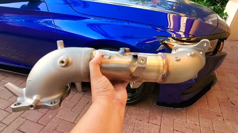 Aftermarket catless downpipe for a Honda Accord