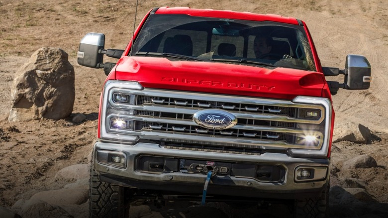 Red 2026 Ford Super Duty truck off-road