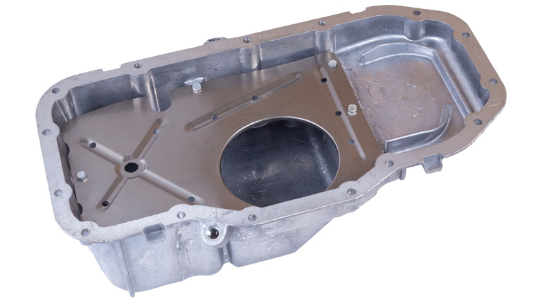 A new die-cast aluminum oil pan against a white backdrop