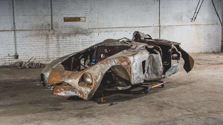 The rusted remains of a 1954 Ferrari 500 Mondial Spider that were sold at auction