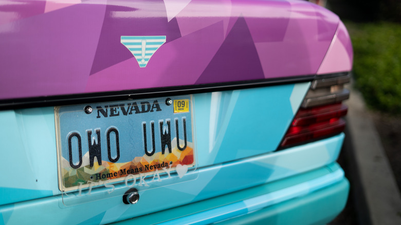 Closeup of a license plate that says OWO UWU