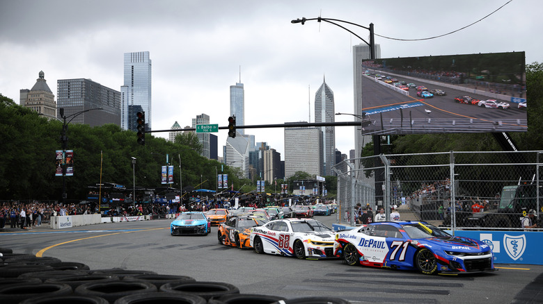Michael McDowell, driver of the #71 DePaul Chevrolet, and Shane Van Gisbergen, driver of the #88 WeatherTech Chevrolet, race during the NASCAR Cup Series Grant Park 165 at Chicago Street Course on July 06, 2025 in Chicago, Illinois.