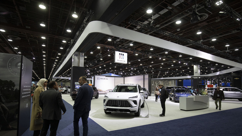 people milling around a Buick stand at the 2025 North American International Auto Show