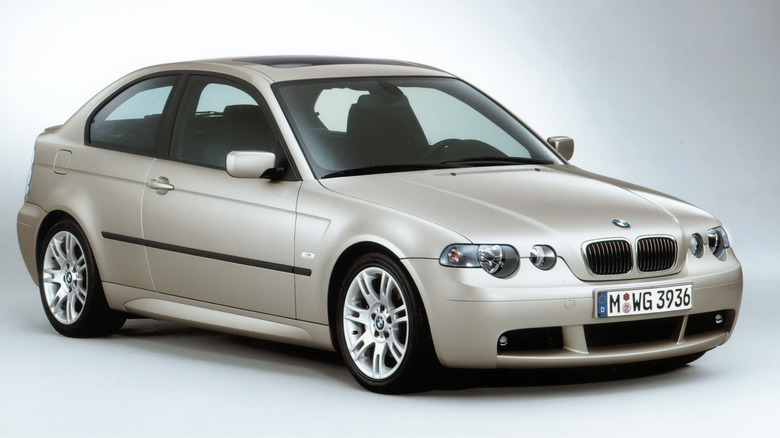 Front 3/4 view of a beige BMW E46 Compact