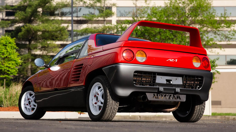 The same red Autozam AZ-1 featured in the first photo of this article, but a sexy dramatic rear shot from below.