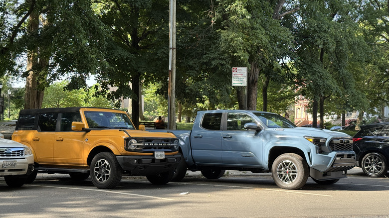 A Ford Bronco and Toyota Tacoma street-parked in Brooklyn