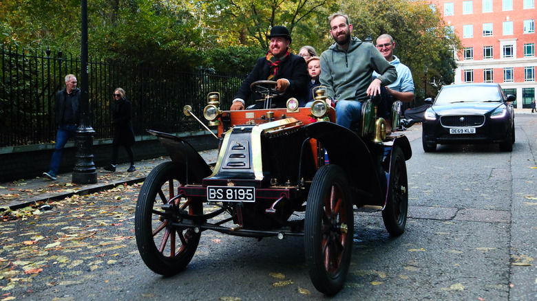Driving an old Franklin coffin-nose car on the street