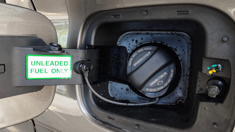 Unleaded fuel only sticker on gas cap.