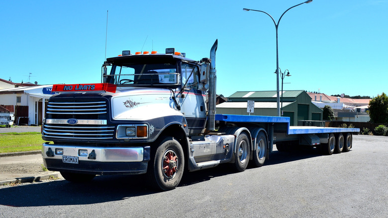 Front-quarter shot of a 1990's Ford L-Series truck