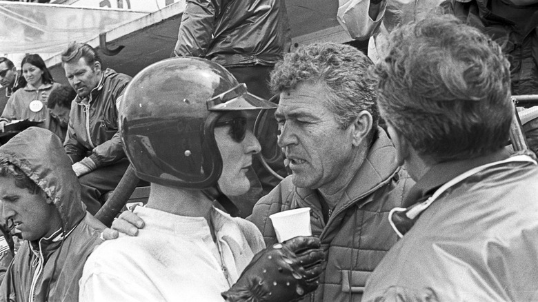 Ken Miles and Carrol Shelby talking at a race