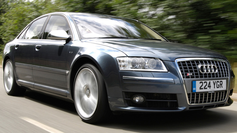 A gray 2009 Audi S8 driving on the road