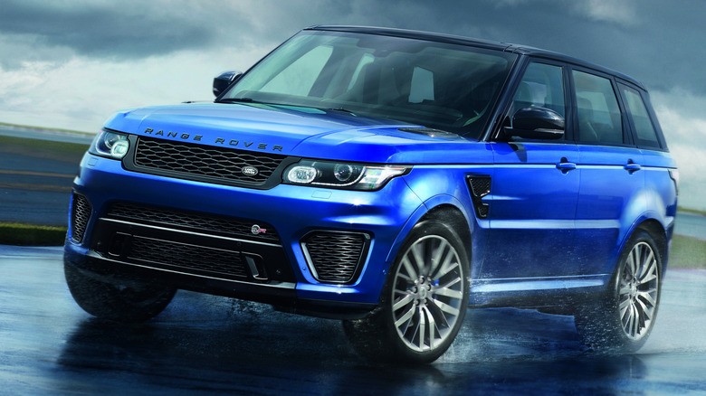 A blue 2014 Range Rover SVR cornering on a track