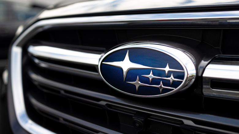 Closeup photo showing Subaru's logo badge on the front grill of a vehicle.