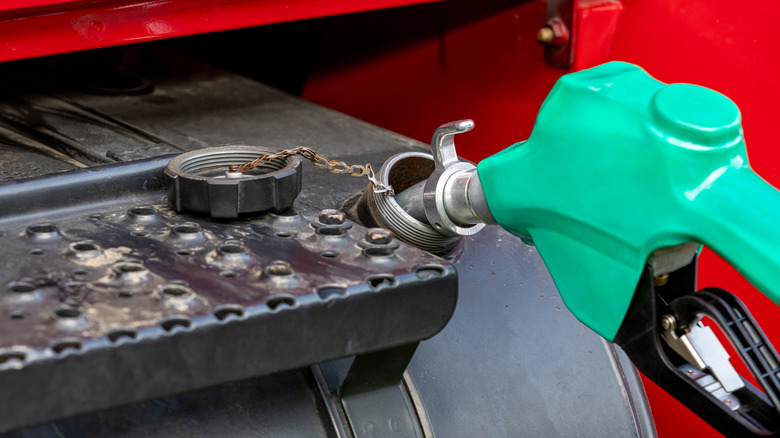 Filling a big rig's tank with diesel fuel