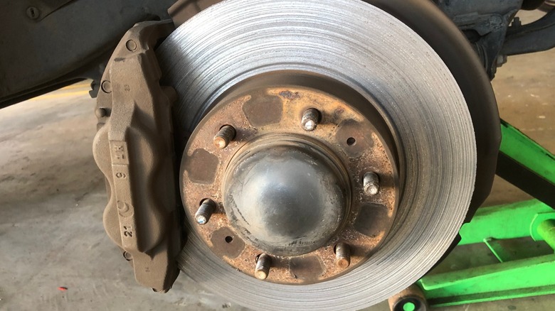 Damaged brake rotor with grooves