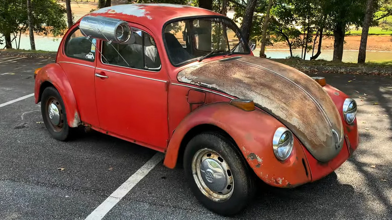 A vintage Volkwagen Beetle with a custom-built swamp cooler